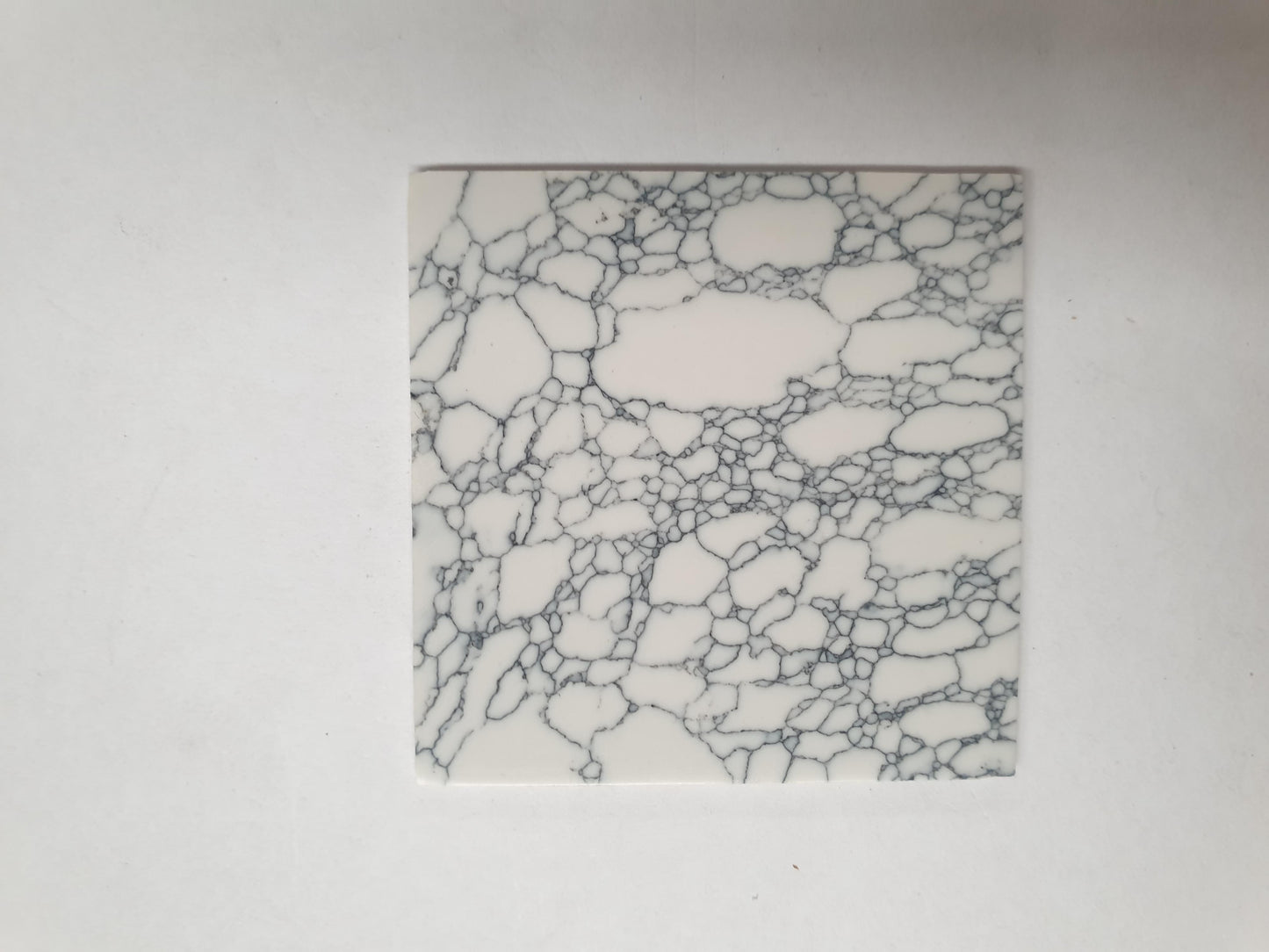 Marble Cremona artificial stone blanks 50 x 50 x 2mm polished 1 side suitable for inlay. Can be cut with standard cutting tools - jewellery saw similar in characteristics to mother of pearl (hardness approx. 3. Can be sanded and polished same way as shell material. All pcs are A grade good on both sides.