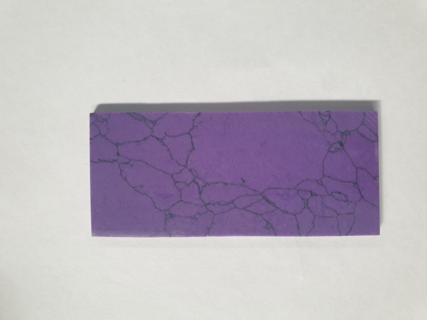 Amethyst artificial stone blanksN115 30 x 50 x 2mm suitable for inlay. Can be cut with standard cutting tools - jewellery saw similar in characteristics to mother of pearl (hardness approx. 3. Can be sanded and polished same way as shell material. All pcs are A grade good on both sides.