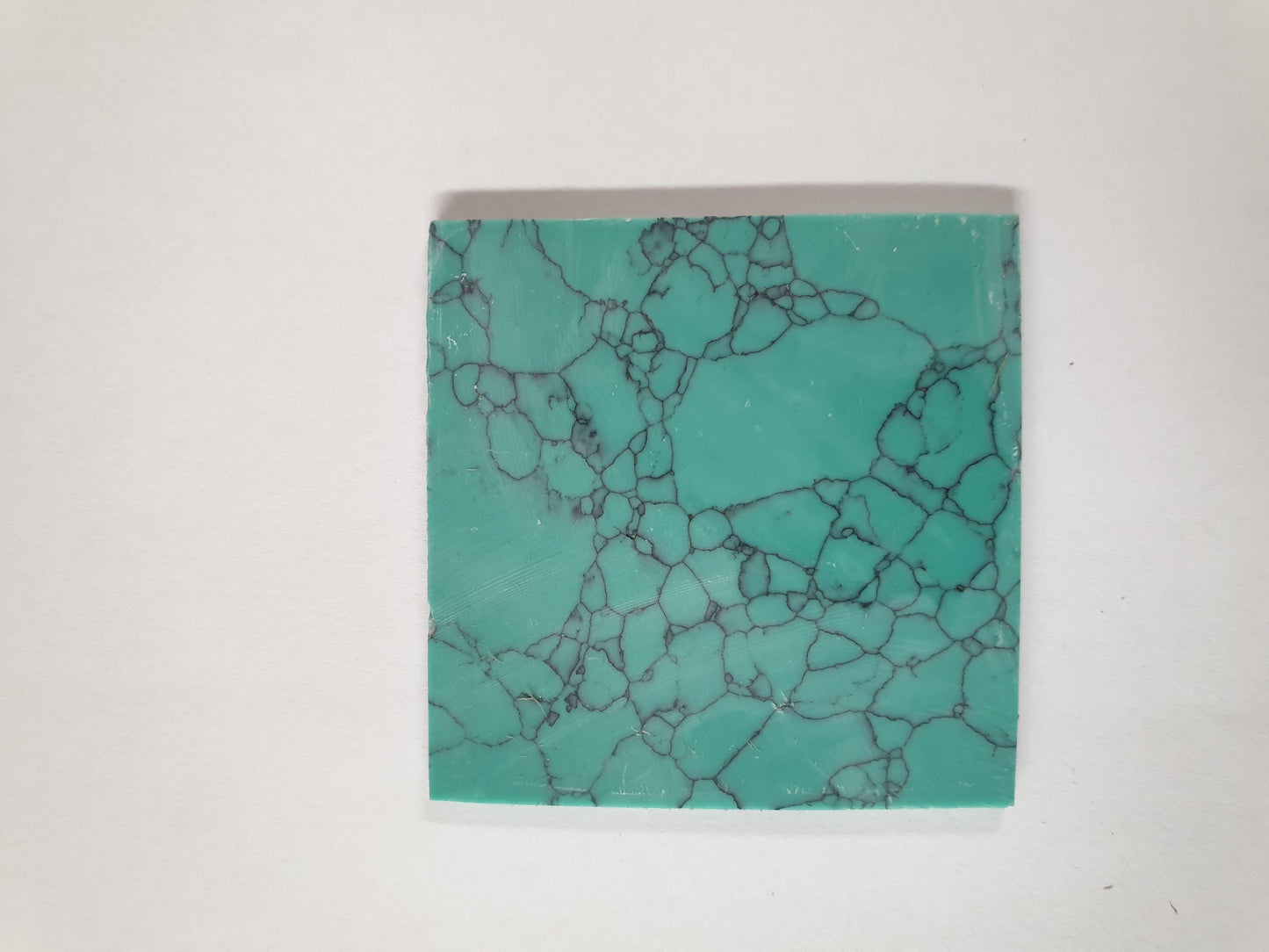 Turquoise Green M114 artificial stone blanks 50 x 50 x 2mm suitable for inlay. Can be cut with standard cutting tools - jewellery saw similar in characteristics to mother of pearl (hardness approx. 3. Can be sanded and polished same way as shell material. All pcs are A grade good on both sides.