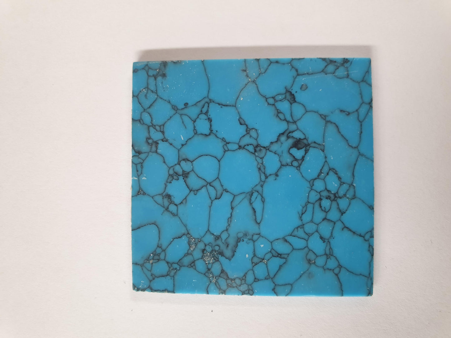 Turquoise Egyptian K094 artificial stone blanks 50 x 50 x 2mm polished 1 side suitable for inlay. Can be cut with standard cutting tools - jewellery saw similar in characteristics to mother of pearl (hardness approx. 3. Can be sanded and polished same way as shell material. All pcs are A grade good on both sides.