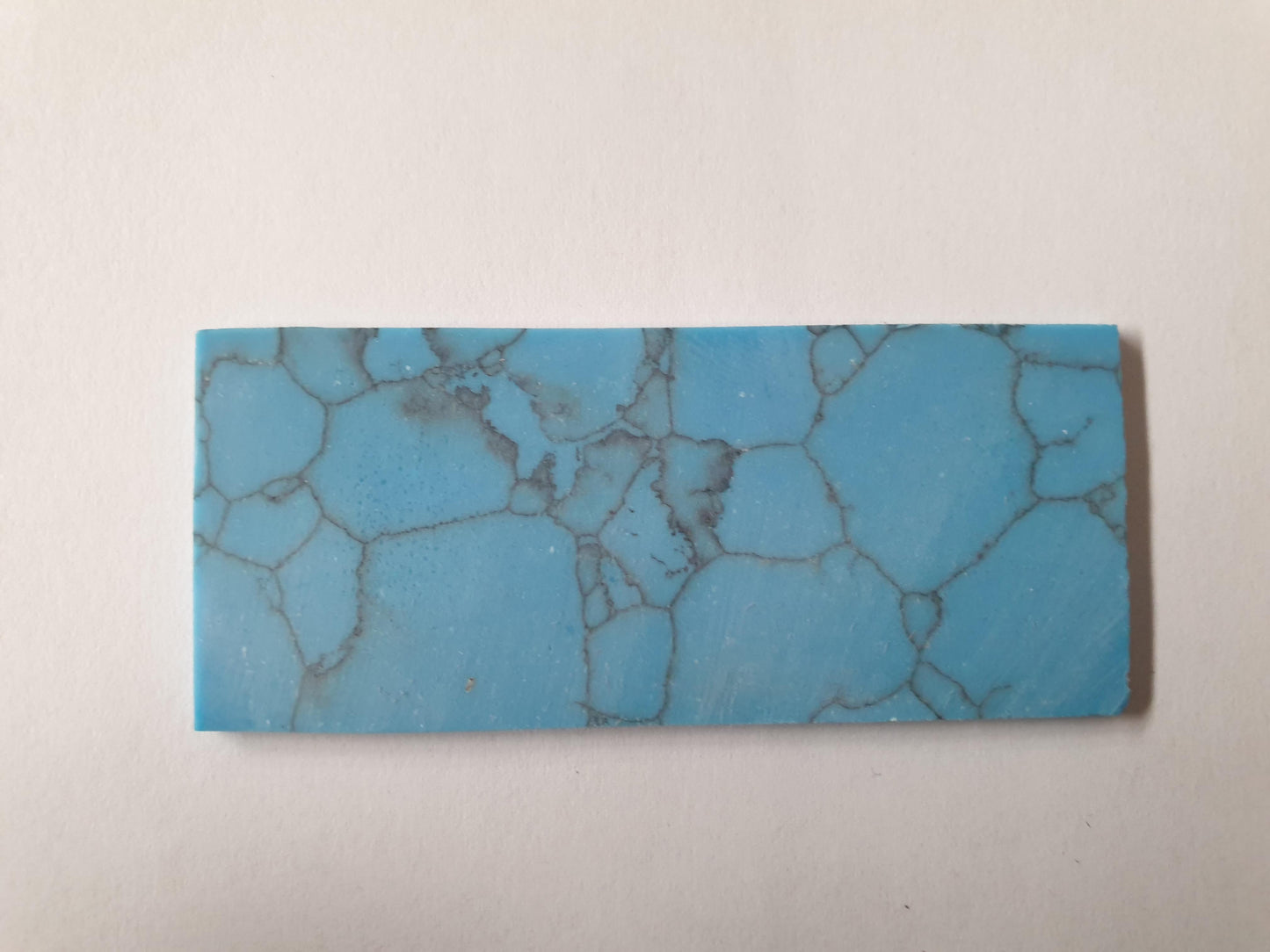 Turquoise Egyptian K094 artificial stone blanks 30 x 70 x 2.5mm suitable for inlay. Can be cut with standard cutting tools - jewellery saw similar in characteristics to mother of pearl (hardness approx. 3. Can be sanded and polished same way as shell material. All pcs are A grade good on both sides.