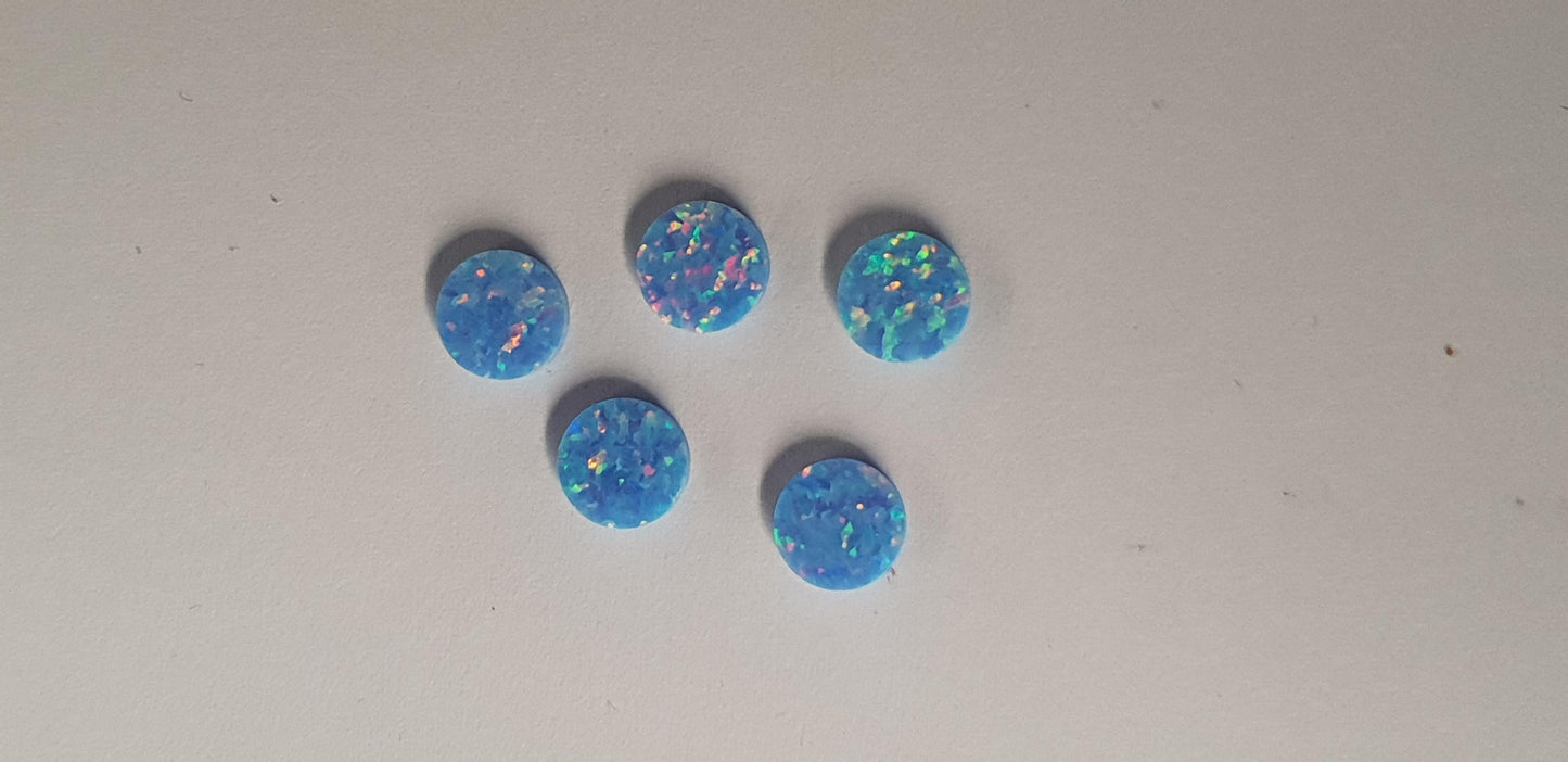 Opal dots OP74 7 x 1.3mm flat pcs made to specific diameter and thickness made from manufactured opal suitable for inlay, fretboard markers, jewellery, Opal dots can be worked same way as mother of pearl and are of similar hardness..
