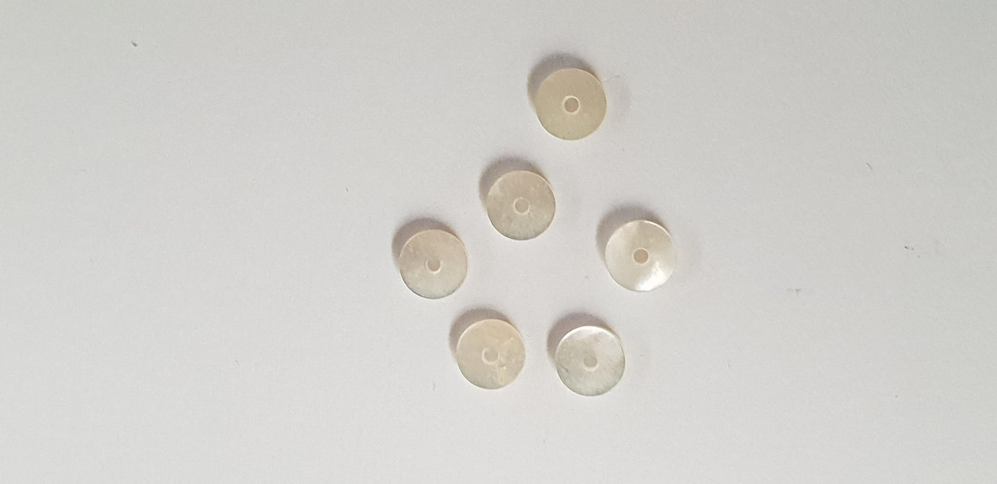 White Mother of Pearl dots 5 x 1mm polished 2 sides with 1mm center hole. Round flat shell pcs cut to precise diameter and thickness. Ideal for watch dials and jewellery decorations. All discs are A grade good on both sides.