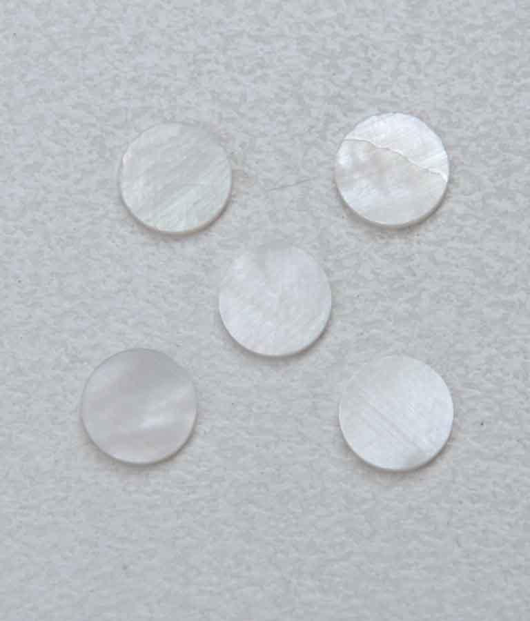 White Mother of Pearl dots 6.35mm (1/4") diameter x 2mm thickness - round flat shell pcs cut to precise diameter and thickness. Ideal for use in inlay applications - for fretboard markers, bow frog eyes and general inlay or jewellery decorations. All dots are A grade good on both sides.