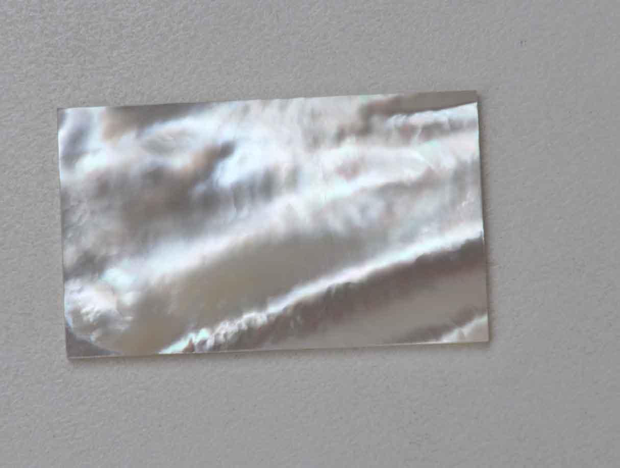<p>White Mother of Pearl flat inlay blanks size 31mm (1.22") width x 58mm (2.283") length x 1.5mm (0.06") thickness A grade good on both sides.</p>