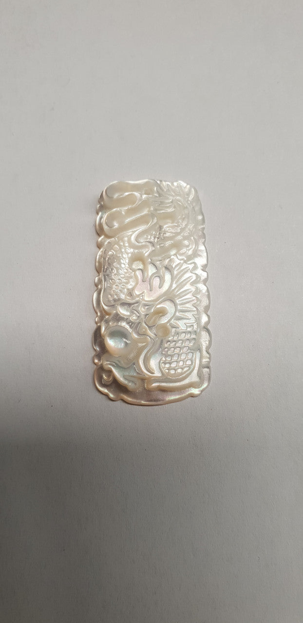 <p>White MOP cabochon dragon 19mm width x 37mm length x 4.5mm thickness. Best grade W, MOP carving high quality precision work. Suitable for jewellery and other decorative applications. A grade.</p>