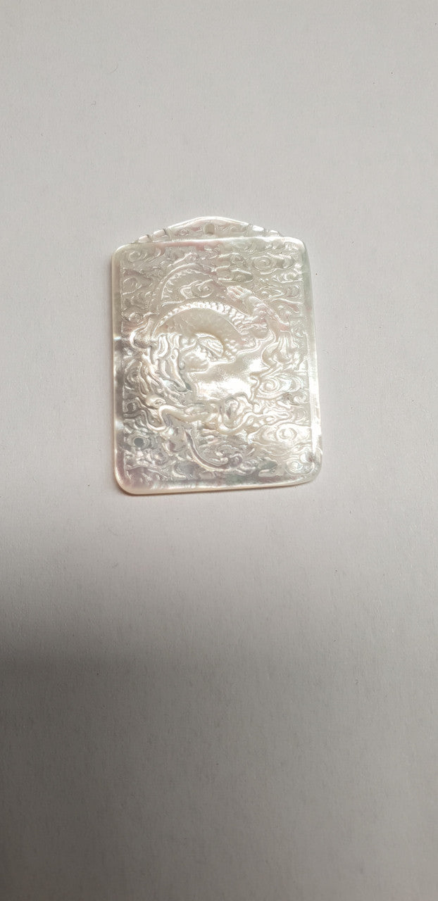 <p>White MOP cabochon dragon 25mm width x 35mm length x 3.5mm thickness. Best grade W, MOP carving high quality precision work. Suitable for jewellery and other decorative applications. A grade.</p>