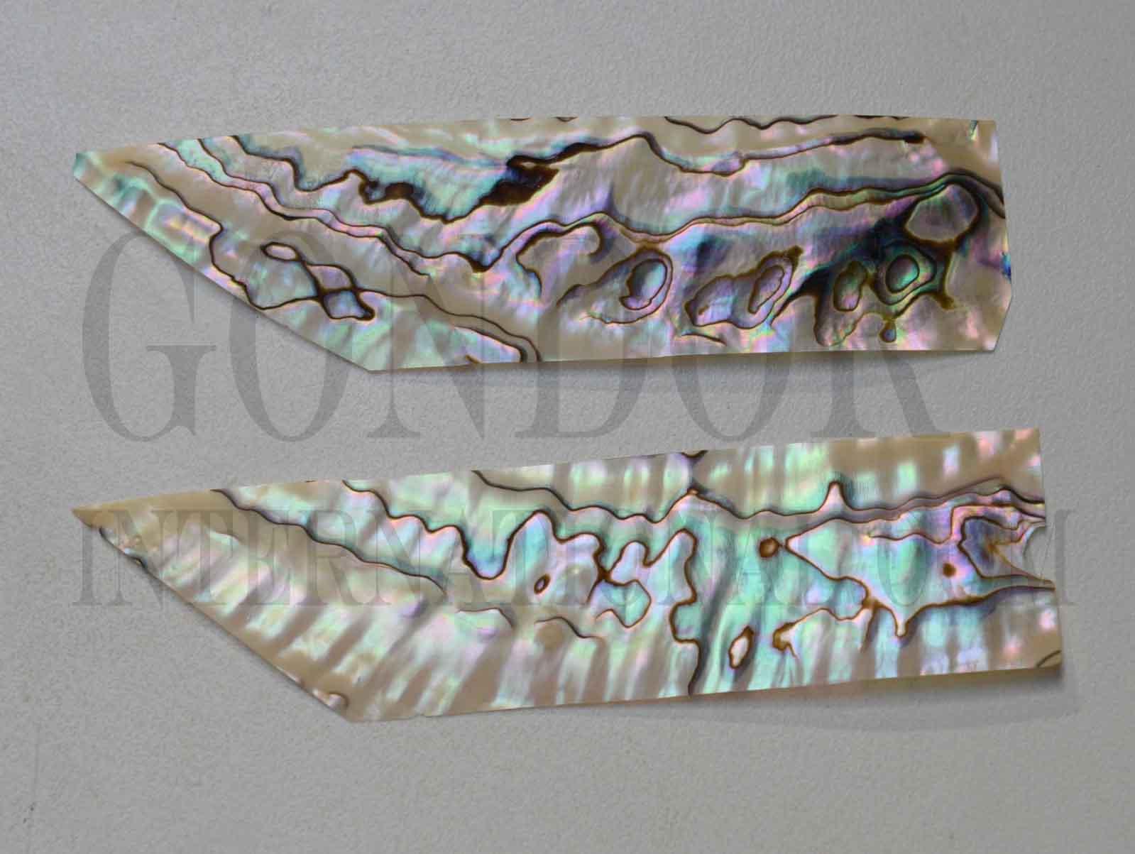 <p>Green abalone shell feathers 30mm (1.18") width x 125mm (4.92") length x 0.15mm (0.006") thickness - thinly sliced solid shell pcs. Cut along the curved part of shell then flattened, they can yield larger pcs then standard solid shell blanks. Ideal for shallow inlay, overlay, fishing lure manufacture and other decorative purposes. Select quality A grade.</p>