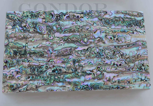 Green abalone - Fully flexible shell sheets made from genuine shell pcs.Size: 240 x 140 x 0.1mm (9.45 x 5.51 x 0.004") Can be folded or rolled up without breaking. Suitable for curved surface decorations. Fishing rods, pens and other tight radius items where standard shell veneer is not sufficiently flexible.Also available with number of options - self adhesive backing (peel and stick), colour coating 1 side and a combination of colour coating and self adhesive.