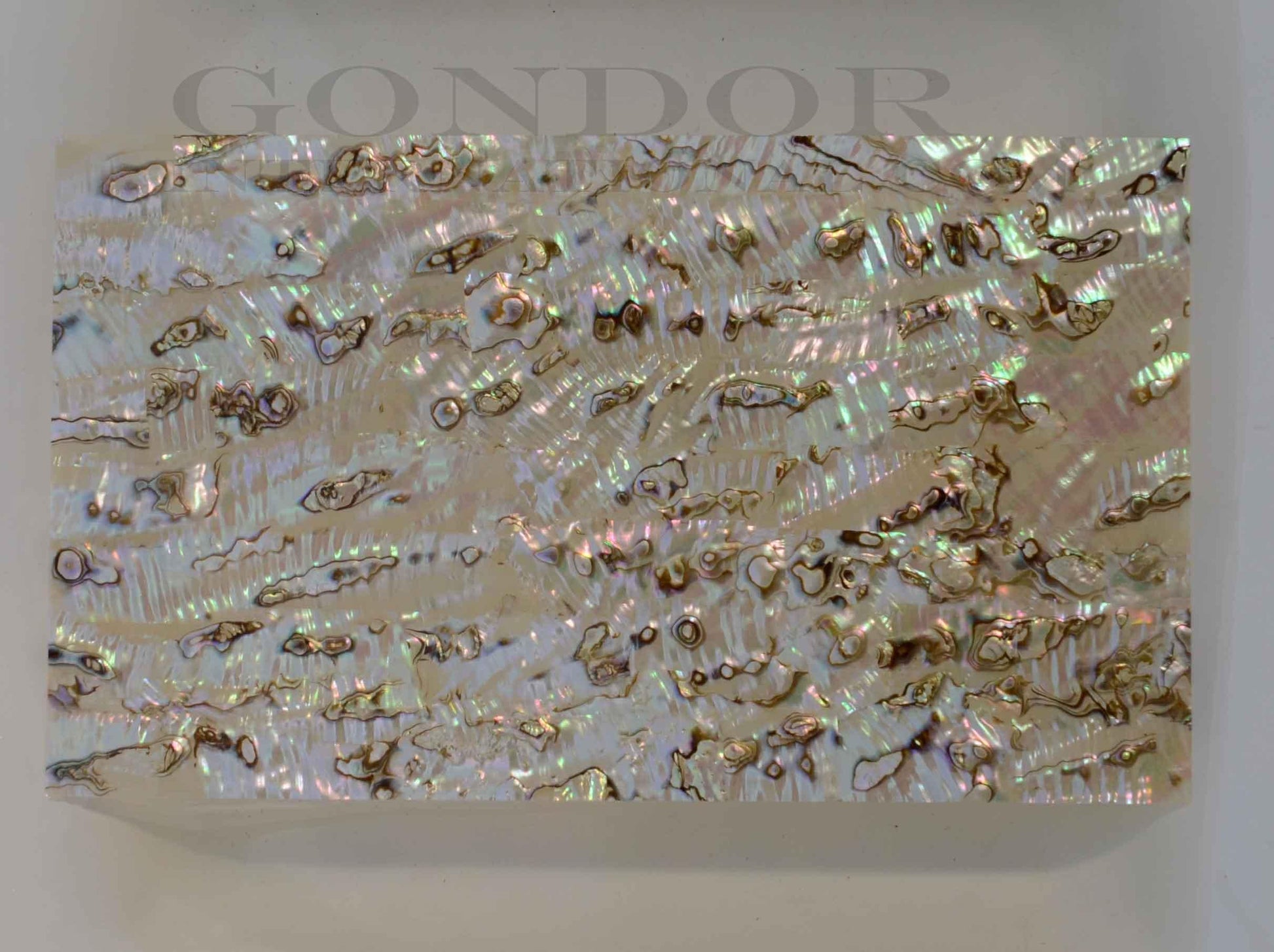 Green abalone light laminated shell sheets are made from genuine shell. Each sheet has shell throughout consisting of layers of smaller shell pcs. Sheet size 235 x 135mm (9.25 x 5.3"). Thickness 0.5mm (0.02") Ideal for inlay work, marquetry, jewellery, knife handles. Economical and easy to cut. All layers are A grade same consistency throughout the sheet.