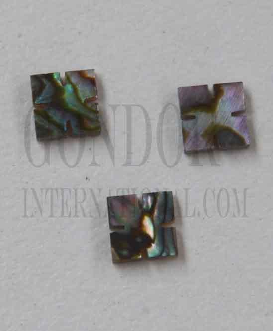 <p>Green abalone (Mexican green abalone) notched squares (slotted squares) size 4mm length x 4mm width x 1.5mm thickness. Some uses include fretboard markers, musical instrument inlay, furniture inlay, marquetry, pool cue inlay and other general decorative inlay and jewellery applications. All pcs are A grade.</p>