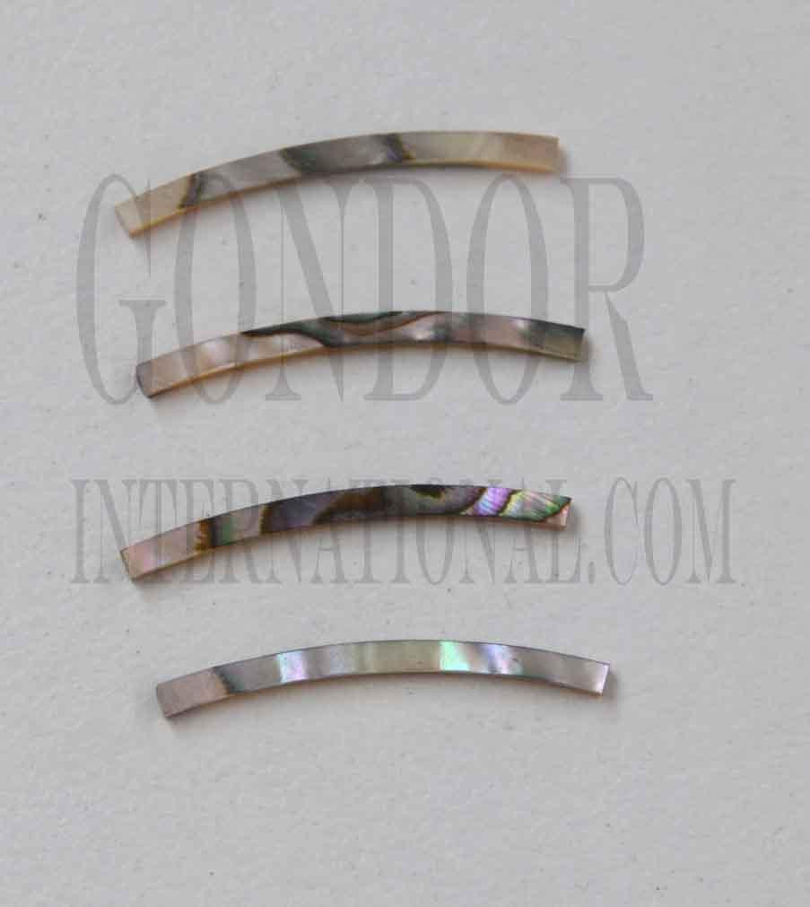 Green abalone solid shell curved strips 2.5mm (0.1") width x 25mm (1") length x 1.5mm (0.06") thickness x 125mm (4.92") inside diameter. A grade quality good on both sides, flat and uniform in thickness and width. Ideal for use in purfling and rosettes on musical instruments - Ukuleles, guitars, mandolins etc. as well as in furniture, jewellery ans other decorative applications.