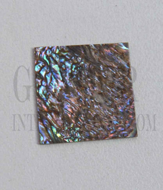 Paua abalone (New Zealand Paua shell) flat inlay blanks heart material size 25mm (1") width x 25mm (1") length x 1mm (0.04") thickness A grade good on at least 1 side may have some worm damage or shell skin on edges of reverse side.