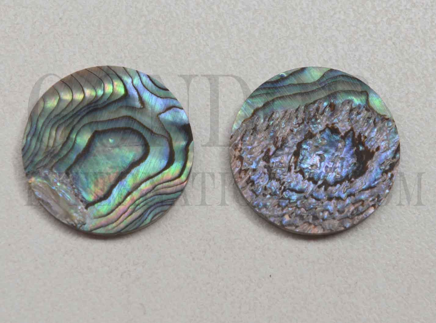 Paua shell dots 18mm diameter x 1.3mm thickness are round flat shell pcs cut to precise diameter and thickness. Ideal for use in inlay applications - for fretboard markers and general inlay or jewellery decorations. All dots are A grade. 