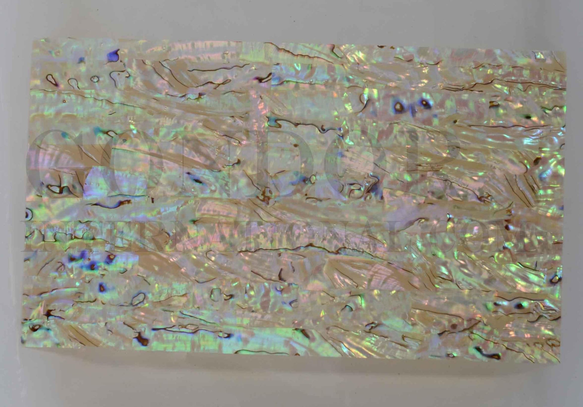 New Zealand Paua shell laminated shell sheets light material made from genuine shell. Each sheet has shell throughout consisting of layers of smaller shell pcs. Sheet size 235 x 135mm (9.25 x 5.3"). Thickness 2.5mm (0.1") Ideal for inlay work, jewellery, knife handles. Economical and easy to cut. All layers are same consistency throughout the sheet.