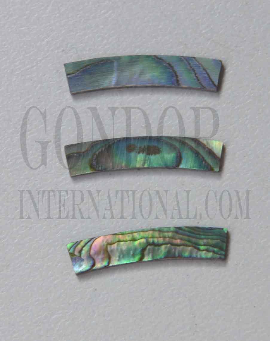 Paua abalone solid shell curved strips 4.76mm (3/16") width x 24mm (0.945") length x 1.3mm (0.05") thickness x 125mm (4.92") inside diameter. A grade quality good on both sides, flat and uniform in thickness and width. Ideal for use in purfling and rosettes on musical instruments - Ukuleles, guitars, mandolins etc. as well as in furniture, jewellery and other decorative applications.