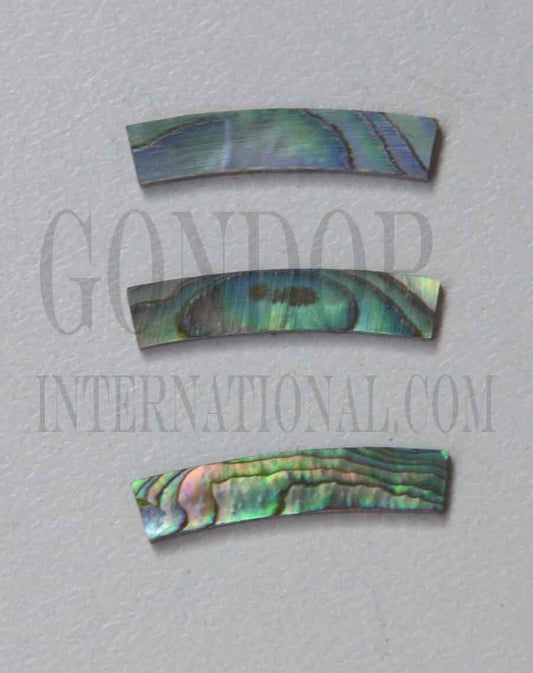 Paua abalone solid shell curved strips 4.76mm (3/16") width x 24mm (0.945") length x 1.3mm (0.05") thickness x 58.42mm (2.3") inside diameter. A grade quality good on both sides, flat and uniform in thickness and width. Ideal for use in purfling and rosettes on musical instruments - Ukuleles, guitars, mandolins etc. as well as in furniture, jewellery and other decorative applications.