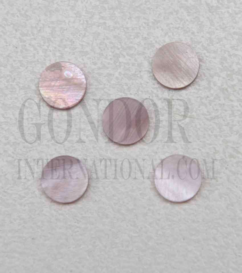 <p>Pink mussel shell dots 6mm diameter x 1.3mm thickness are round flat shell pcs cut to precise diameter and thickness. Ideal for use in inlay applications - for fretboard markers and general inlay or jewellery decorations. All dots are A grade.&nbsp;</p>