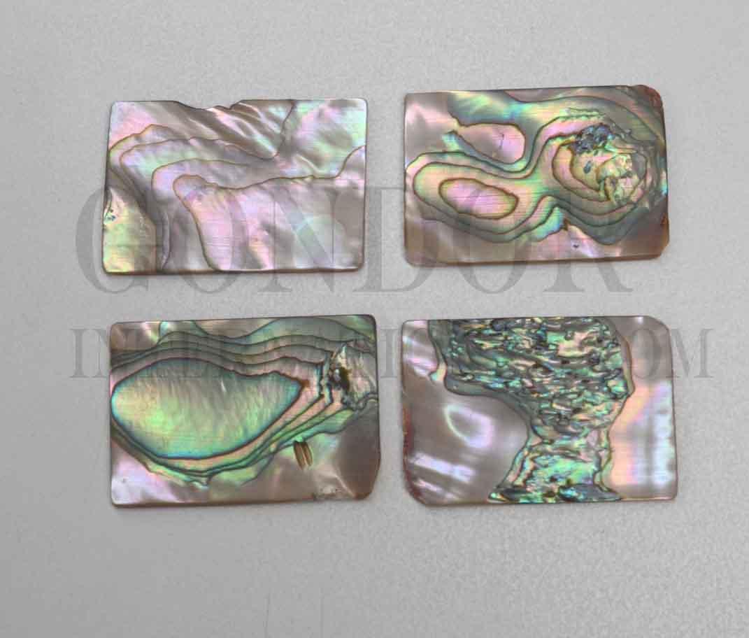 <p>Red abalone polished cabochons size 35mm (1.38") width x 50mm (2") length x 2mm (0.08") thickness. Polished cabochon pcs 1 side is flat other side has natural shell curve. Suitable for jewellery as well as inlay and other decorative applications. A grade good on at least 1 side.</p>