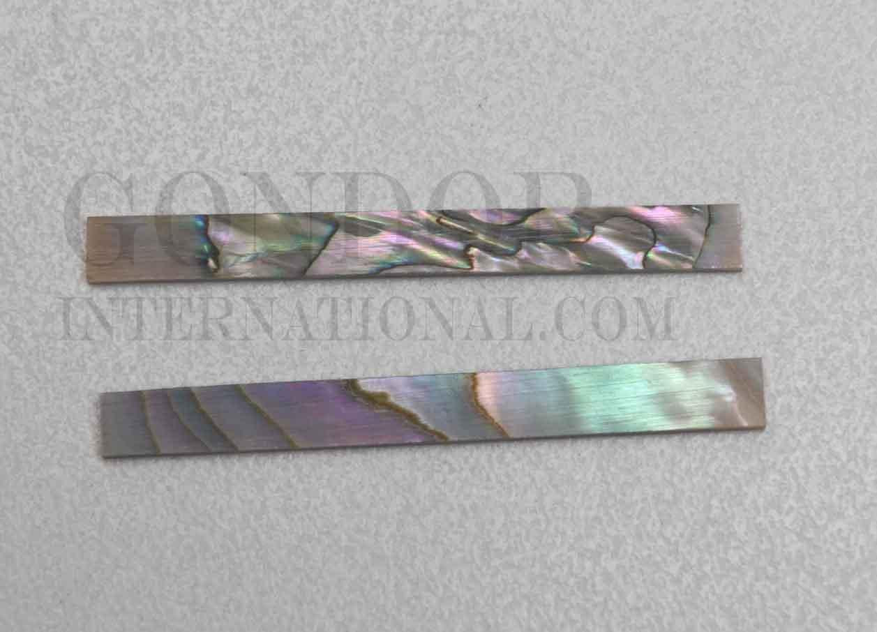 Red abalone solid shell straight strips 3.17mm (1/8") width x 25mm (1") length x 1.3mm (0.05") thickness. A grade quality good on both sides, flat and uniform in thickness and width. Ideal for use in purfling on musical instruments - Ukuleles, guitars, mandolins etc. as well as in furniture, jewellery ans other decorative applications.