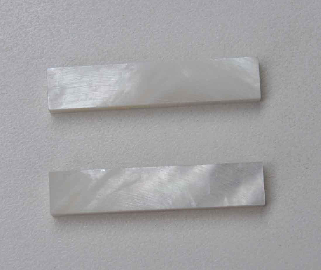 White Mother of Pearl flat nut blanks size 10mm (0.394") width x 50mm (1.97") length x 6.35mm (1/4") thickness A grade good on both sides.