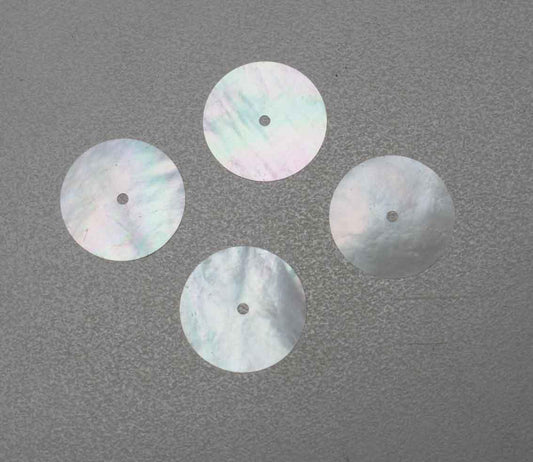 White Mother of Pearl discs with center hole 18.5mm (0.73") diameter x 0.12mm (0.0047") thickness Center hole diameter 1.5mm (0.06&#39;) - round flat shell pcs cut to precise diameter and thickness. Ideal for watch dials, jewellery decorations. All discs are A grade good on both sides. 