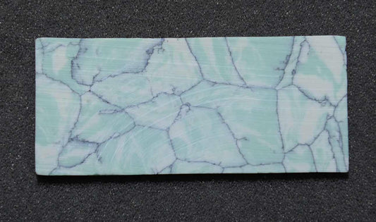 <p>Tunisian marble CH2C4 reconstituted stone blanks 30 x 70 x 1.5mm suitable for inlay. Can be cut with standard cutting tools - jewellery saw similar in characteristics to mother of pearl (hardness approx. 3. Can be sanded and polished same way as shell material. All pcs are A grade good on both sides.</p>