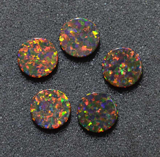 <p>Opal dots OP34 8 x 1.3mm flat pcs made to specific diameter and thickness made from manufactured opal suitable for inlay, fretboard markers, jewellery, Opal dots can be worked same way as mother of pearl and are of similar hardness.</p>