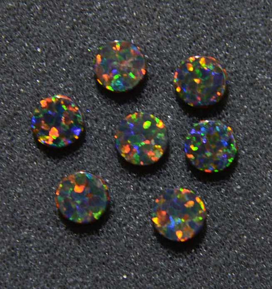 <p>Opal dots OP34 6.35 x 1.3mm 1/4" x 0.05" flat pcs made to specific diameter and thickness made from manufactured opal suitable for inlay, fretboard markers, jewellery, Opal dots can be worked same way as mother of pearl and are of similar hardness.</p>