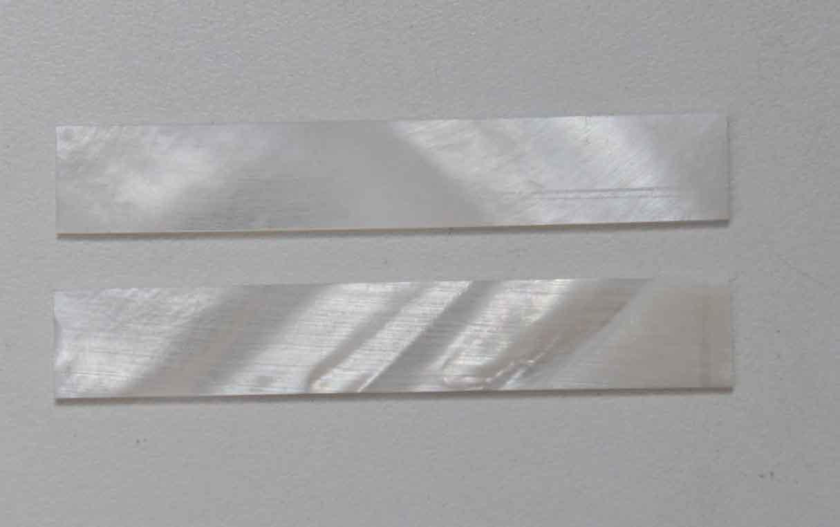 <p>White Mother of Pearl flat inlay blanks size 11mm (0.433") width x 87mm (3.42") length x 1mm (0.04") thickness A grade good on both sides.</p>