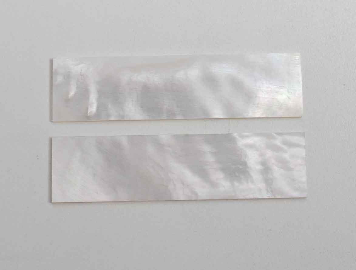 <p>White Mother of Pearl flat inlay blanks size 20mm (0.79") width x 60mm (2.36") length x 1.5mm (0.06") thickness A grade clean on both sides.</p>