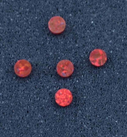 <p>Opal dots OP45 2 x 1.3mm flat pcs made to specific diameter and thickness made from manufactured opal suitable for inlay, fingerboard markers, jewellery, Opal dots can be worked same way as mother of pearl and are of similar hardness.</p>