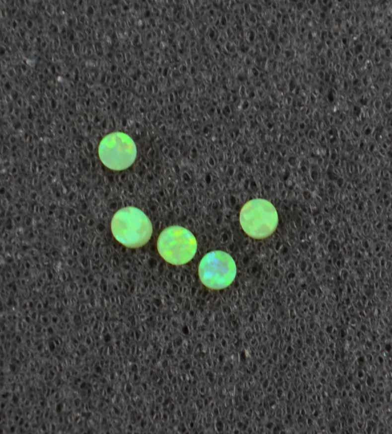 <p>Opal dots OP68 2 x 1.3mm flat pcs made to specific diameter and thickness made from manufactured opal suitable for inlay, fingerboard markers, jewellery, Opal dots can be worked same way as mother of pearl and are of similar hardness.</p>