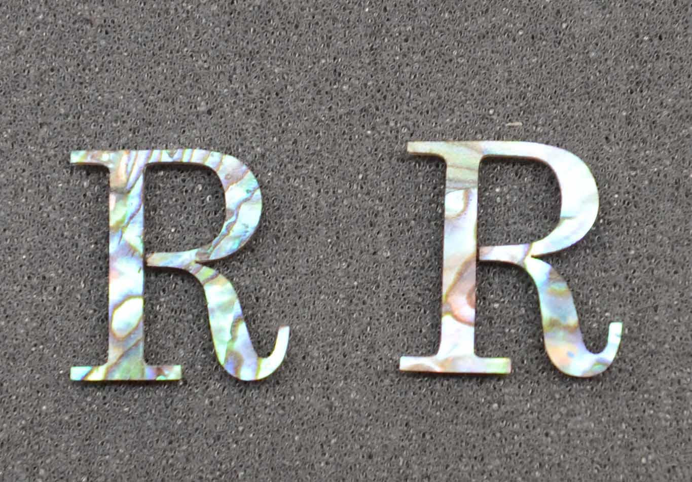 <p>Precut logo Letter R size 18mm height x 12mm width x 1.5mm thickness available in Paua shell.</p>