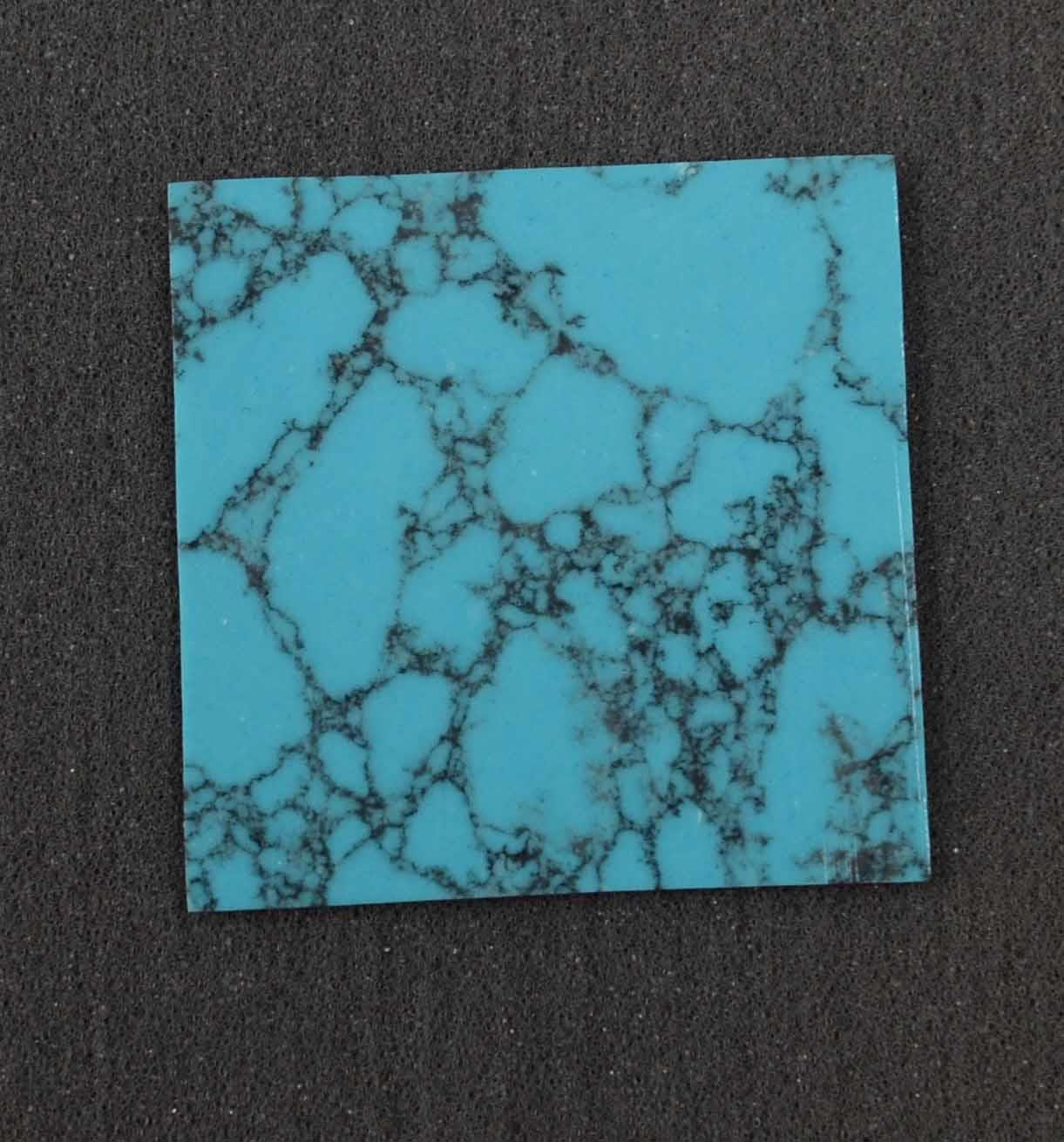 <p>Arizona Turquoise K02&nbsp; reconstituted stone blanks 50 x 50 x 1.5mm suitable for inlay and other decorations. Can be cut with standard cutting tools - jewellery saw similar in characteristics to mother of pearl (hardness approx. 3. Can be sanded and polished same way as shell material. All pcs are A grade good on both sides.</p>