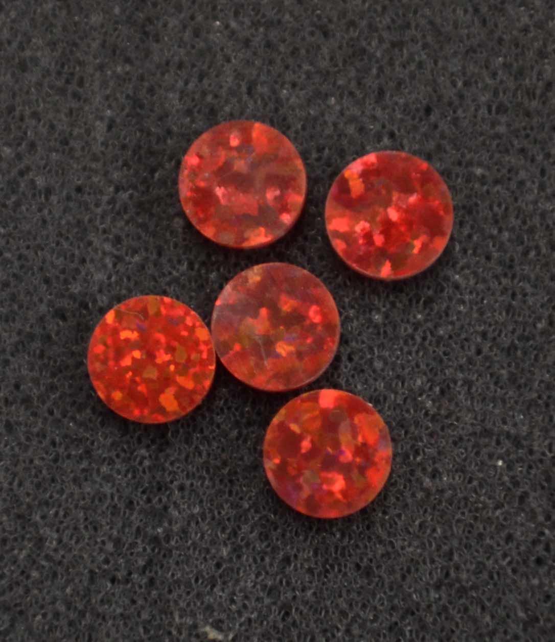 <p>Opal dots OP45 4 x 1.3mm flat pcs made to specific diameter and thickness made from manufactured opal suitable for inlay, fingerboard markers, jewellery, Opal dots can be worked same way as mother of pearl and are of similar hardness.</p>