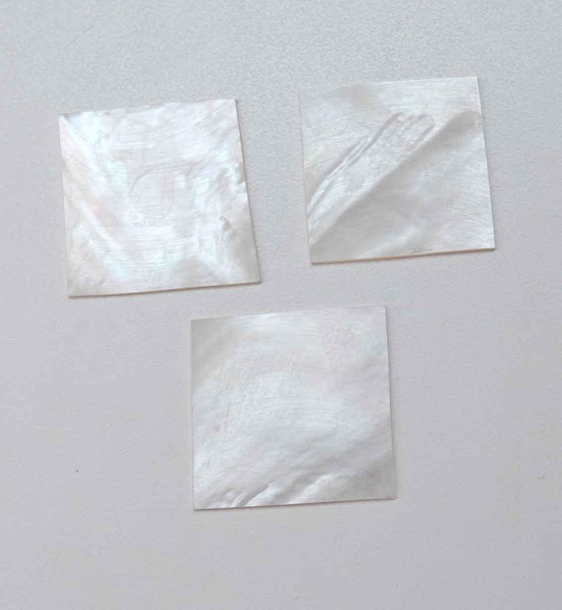 <p>White Mother of Pearl flat inlay blanks size 50 - 55mm (1.97 - 2.16") width x 50 - 55mm (1.97 - 2.16") length x 0.5mm (0.02") thickness. A grade good on both sides.</p>