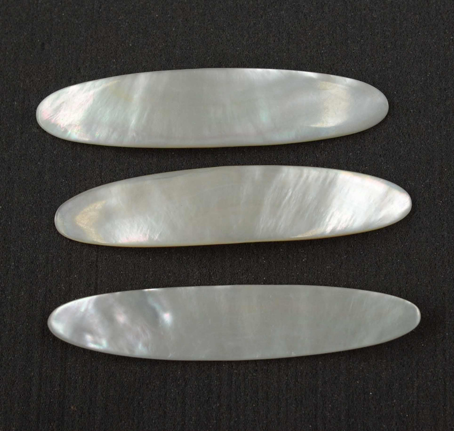 <p>White Mother of Pearl fishing lures (fishing spoons) size 22mm wide x 120mm long specially cut and polished solid shell pcs. Made to specific bent shape no holes.</p>