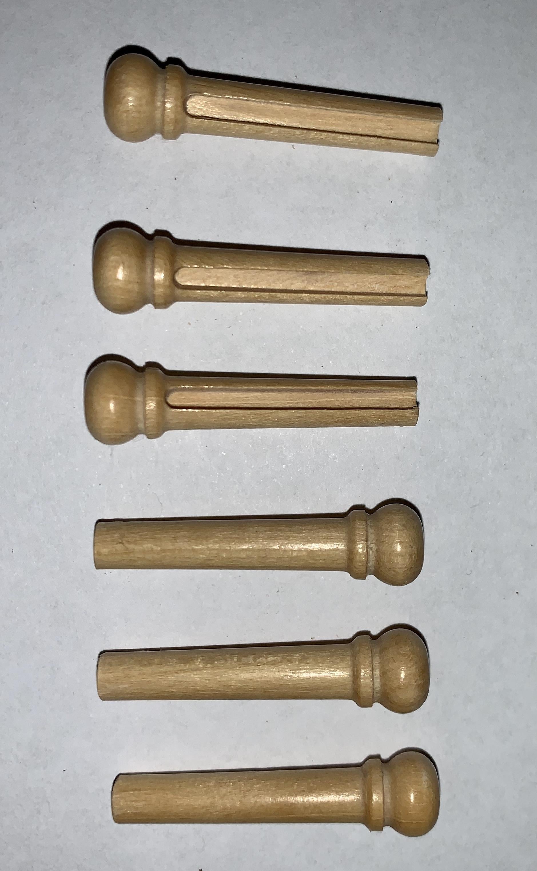 1 set (6pcs) Guitar bridge pins  size 1 Ivory wood Tapered shaft string slot running the full length of shaft. Diameter at top of shaft 5.3mm (0.21") length of shaft 22.9mm (0.9") . Will fit the following models - Martin guitars prior to 1994 (except HD-28), Collings guitars, prior to 2002, Blanchard, Garrison, Goodall, Ryan, Santa Cruz, Taylor, Larrivee D-03R and others.