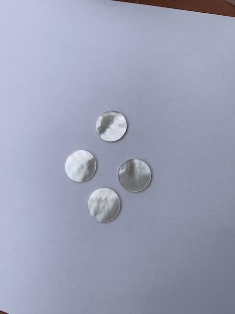 <p>White Mother of Pearl polished discs both sides 18mm (0.71") diameter x 1.3mm (0.05") thickness&nbsp; - round flat shell pcs cut to precise diameter and thickness. Ideal for inlay applications, watch dials and jewellery decorations. All discs are A grade good on both sides.&lt;br /&gt;</p>