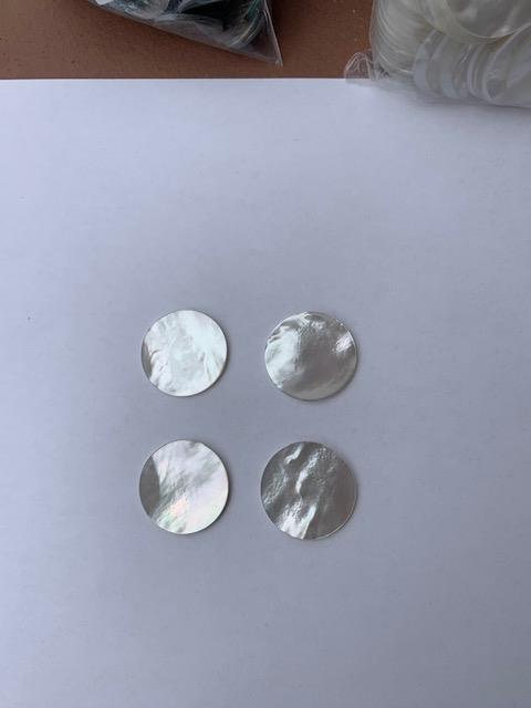 <p>White Mother of Pearl polished discs both sides 20mm (0.79") diameter x 1.3mm (0.05") thickness&nbsp; - round flat shell pcs cut to precise diameter and thickness. Ideal for inlay applications, watch dials and jewellery decorations. All discs are A grade good on both sides.</p>