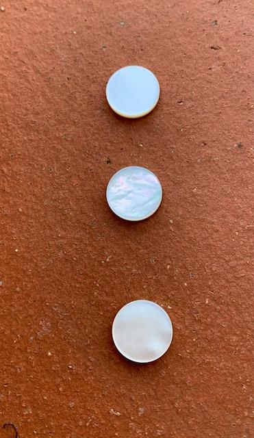 <p>White Mother of Pearl domed finger button inlay 11.5mm (0.45") diameter 2.2mm (0.09") thickness domed and polished on 1 side round pcs Ideal for use in brasswind or woodwind instruments as well as accordions and general inlay or jewellery decorations. All pcs are A grade.</p>