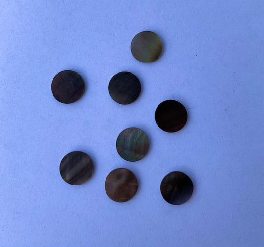 Black Mother of Pearl shell dots 10mm diameter 1.3mm thickness polished on 2 sides round flat shell pcs cut to precise diameter and thickness. Ideal for use in watch dials, inlay applications jewellery decorations. All pcs are A grade.