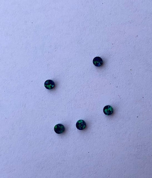 <p>Opal dots OP32 2 x 1.3mm flat pcs made to specific diameter and thickness made from manufactured opal suitable for inlay, fingerboard markers, jewellery, Opal dots can be worked same way as mother of pearl and are of similar hardness.</p>