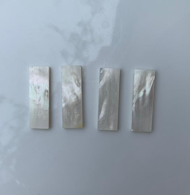 <p>White Mother of Pearl flat inlay blanks size 11.5mm (0.45") width x 36mm (1.42") length x 2mm (0.08") thickness A grade good on both sides.</p>