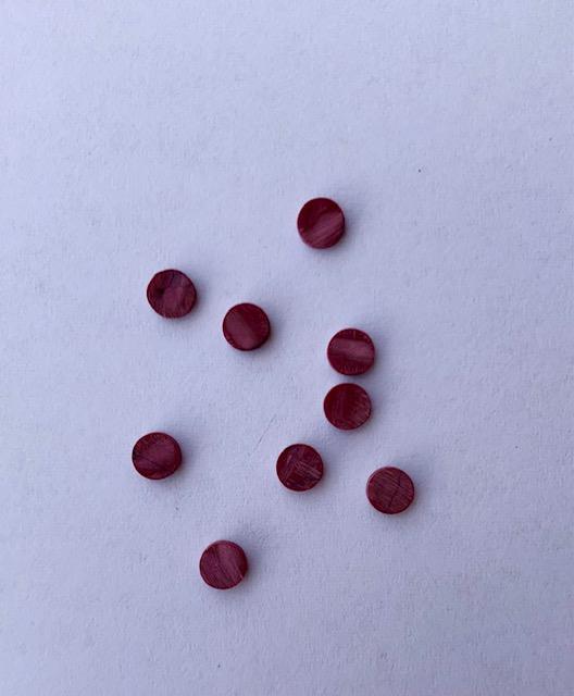 <p>Bloody Jasper SJASPER reconstituted stone dots 2 x 1.3mm suitable for inlay. Can be cut with standard cutting tools - jewellery saw similar in characteristics to mother of pearl (hardness approx. 3. Can be sanded and polished same way as shell material. All pcs are A grade good on both sides.</p>