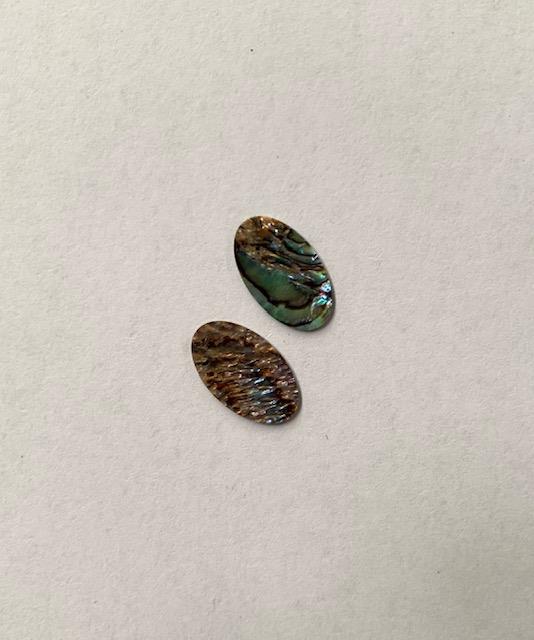 <p>Paua abalone (New Zealand Paua abalone) polished ovals size 9.2mm (0.4") width x 15.5mm (0.6") length x 0.2mm (0.008") thickness. Some uses include fretboard markers, musical instrument inlay, furniture inlay, marquetry, pool cue inlay and other general decorative inlay and jewellery applications. All pcs are A grade.</p>