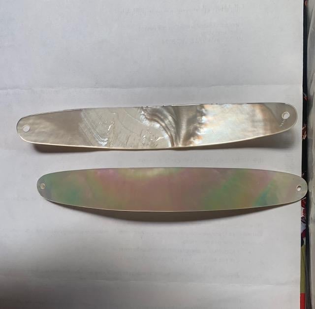 <p>White Mother of Pearl fishing lures (fishing spoons) size 23mm wide x 150mm long specially cut and polished solid shell pcs. Made to specific bent shape no holes.</p>