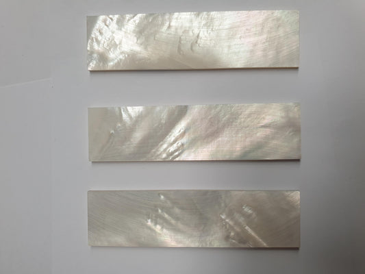 <p>White Mother of Pearl flat inlay blanks size 26mm (1.02") width x 100mm (3.93") length x 3mm (0.12") thickness A grade clean on both sides.</p>