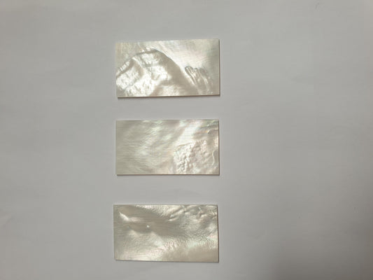 <p>White Mother of Pearl flat inlay blanks size 30mm (1.18") width x 57mm (2.24") length x 1.5mm (0.06") thickness A grade good on both sides.</p>